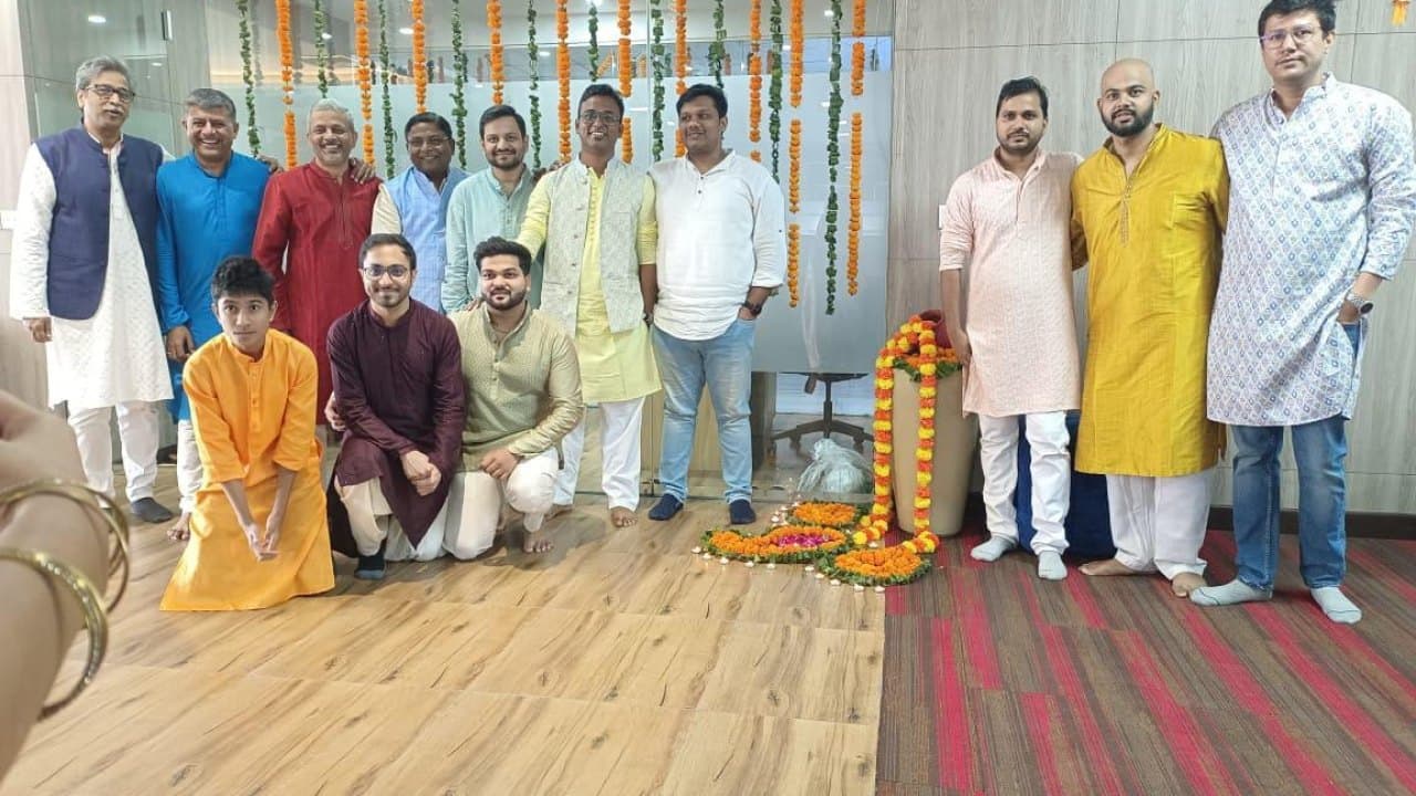 The CoreOps.AI team at a celebration in the office